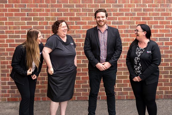 Group of Police Credit Union team members laughing together