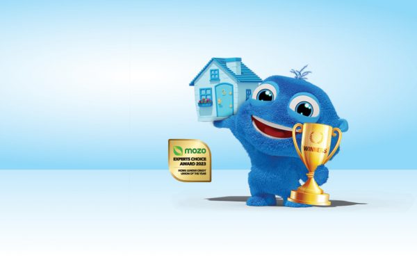 Poccu holding up house and trophy saying 'Winners', with Mozo expert choice award 2023 next to him
